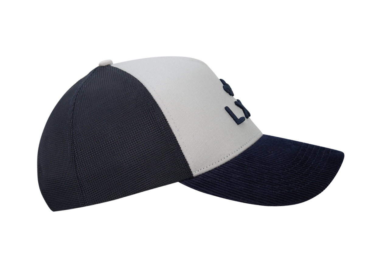 Casquette bi-matière coton velours homme avec visière bleu marine et design moderne