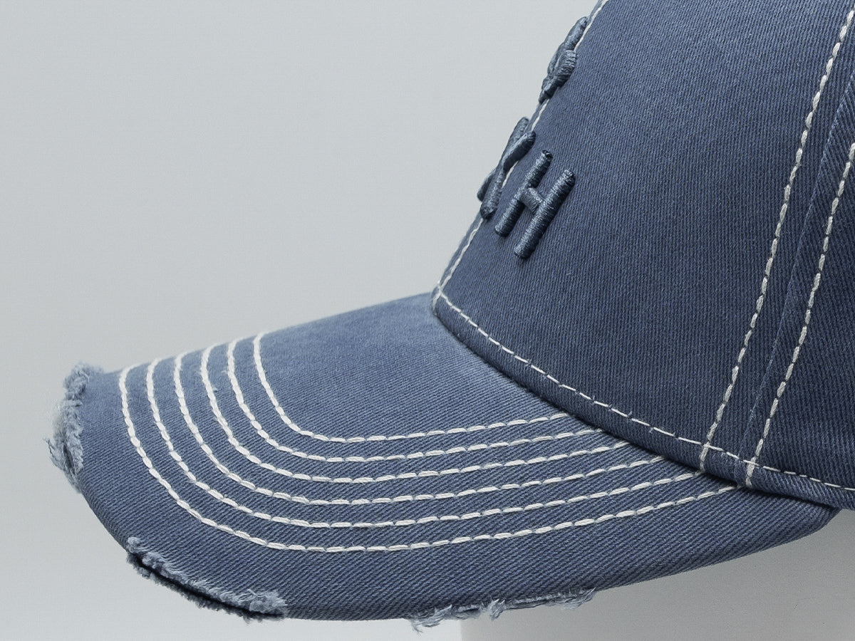 Casquette bleu disrupt LXH avec visière usée et design moderne