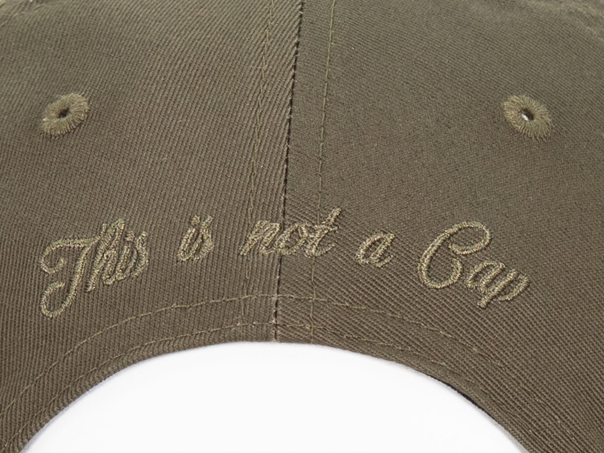 Casquette coton kaki haut de gamme avec broderie 'This is not a Cap' à l'arrière