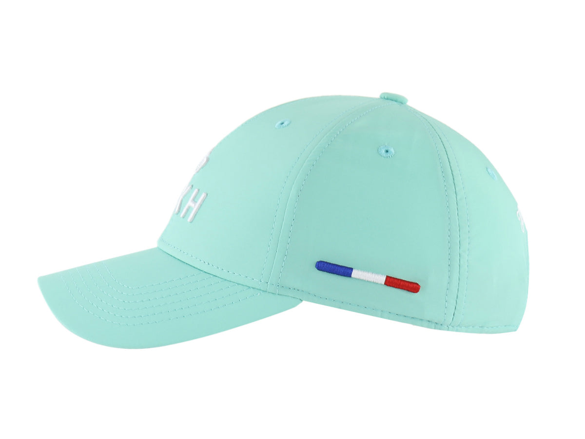Casquette vert pastel nylon de la marque LXH avec logo et détails tricolores à l'arrière