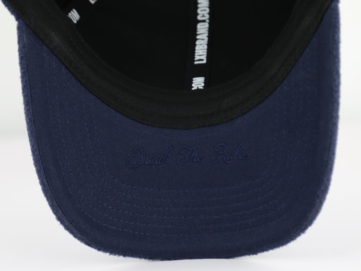 Casquette LXH en polaire bleu marine avec inscription 'Break The Rules' sur la visière