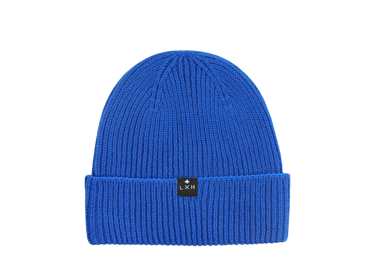 Bonnet laine mérinos bleu de la marque LXH avec un style côtelé et logo moderne